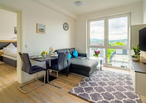 Khu vực ghế ngồi tại City4Living Boardinghaus Bad Nauheim