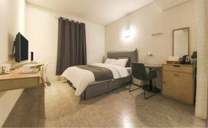 Ami Boutique Hotel, Yongin房間的床