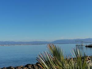 a view of a body of water with a pier at Il mare b&b in Quartu SantʼElena