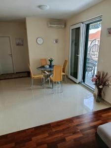 a dining room with a table and chairs at Golden Panorama in Novalja