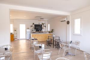 a restaurant with tables and chairs and a counter at beb Sicily in Love in Taormina