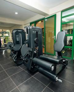 a gym with two rows of chairs in a room at Highlands Suites Hotel and Apartments in Kigali