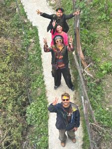 a group of people standing on a path at Kasolview Homestay and Peace Inn Cafe in Kasol