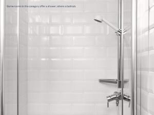 a shower with a glass door in a bathroom at Numa Prague Root in Prague