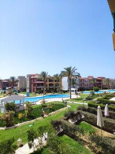 a view of a resort with a swimming pool at Taha Yahia Porto Matrouh For Family Only in Marsa Matruh