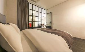 Ami Boutique Hotel, Yongin房間的床