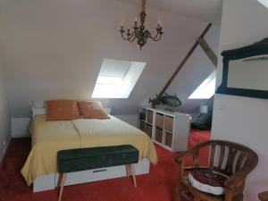 Postel nebo postele na pokoji v ubytování Chez Hortense 56