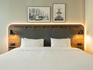 Postel nebo postele na pokoji v ubytování Campanile Hotel & Restaurant Amsterdam Zuid-Oost + 30 fotografií