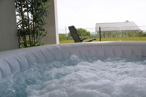 a jacuzzi tub filled with lots of snow at Mountainview - Deluxe in Lottstetten
