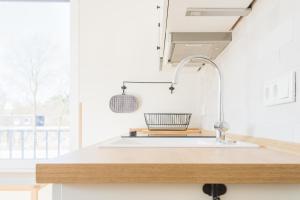 a kitchen with a sink and a window at Zweitraum in Oldenburg in Oldenburg +45 photos