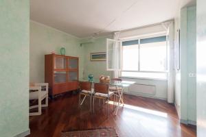 a dining room with a table and a window at Appartamento fronte mare in Portovenere
