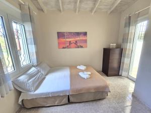 a bedroom with a bed with two towels on it at Casa Di Oliva 2 in Vergia