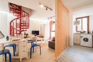 a kitchen and living room with a table and chairs at Ático Cierzo Nuevo Duplex Terraza WiFi 1 BR in Zaragoza +24 photos