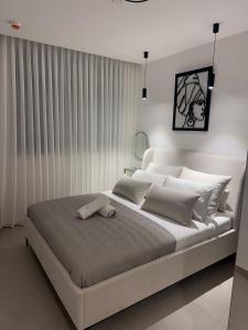 Ένα ή περισσότερα κρεβάτια σε δωμάτιο στο bnb360 - 70