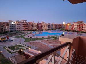 a view from a balcony of a resort with two pools at Porto Sharm Hotel in Sharm El Sheikh +23 photos