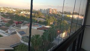 a view of a city from a window at Studio 803 in Marília