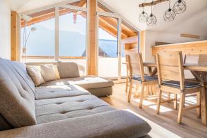 a living room with a couch and a table at Bio-Bergbauernhof Lasserbauer in Krispl