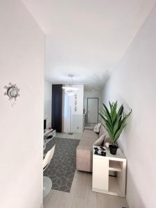 a living room with a couch and a table at Augustus roman emperor in Lido di Jesolo