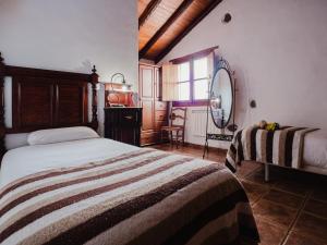 Ένα ή περισσότερα κρεβάτια σε δωμάτιο στο Las Calas A by Villas Rivero