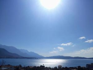 a view of a large body of water with the sun at Bella Casa in Bijela