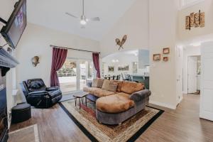 a living room with a couch and a chair at House w Hot Tub - Wifi - Fireplace - Pets Ok in Deming