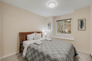 a bedroom with a large bed and a window at House w Hot Tub - Wifi - Fireplace - Pets Ok in Deming