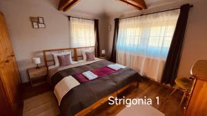 Posteľ alebo postele v izbe v ubytovaní Strigonia Apartman
