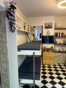 a room with two bunk beds and a checkered floor at Il Quadrifoglio in Arenzano +35 photos