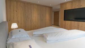 Postel nebo postele na pokoji v ubytování Wellnesshotel Mein Almhof Superior
