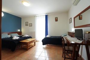 Postel nebo postele na pokoji v ubytování Camere il Cantico
