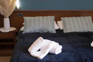 Postel nebo postele na pokoji v ubytování Camere il Cantico