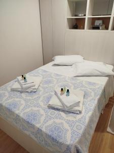 Giường trong phòng chung tại Estúdio Guimarães