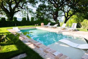 The swimming pool at or close to Ca' le cerque, villa surrounded by the Marche nature