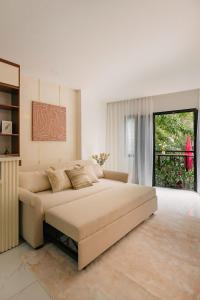 a bedroom with a large bed and a large window at Classic house 3MasterBR HoanKiem Lake by SSens Homes in Hanoi