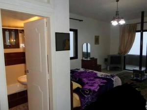 Кровать или кровати в номере Noujoum El Sama