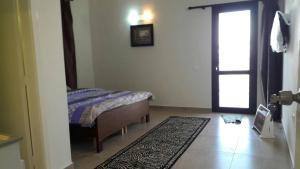 Кровать или кровати в номере Noujoum El Sama