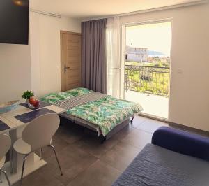 Postel nebo postele na pokoji v ubytování Apartmani Dalmacjia