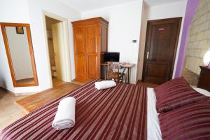 Postel nebo postele na pokoji v ubytování Camere il Cantico