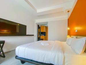 Postel nebo postele na pokoji v ubytování MANOU HOTEL