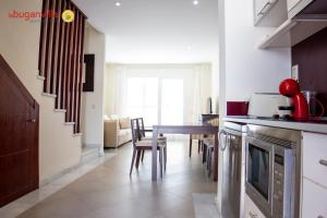 A kitchen or kitchenette at Apartamentos la Buganvilla