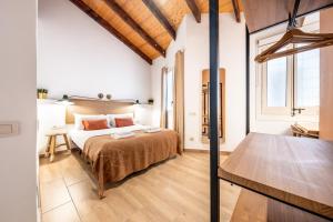 Posteľ alebo postele v izbe v ubytovaní Caliu Apartments Barcelona - Fira