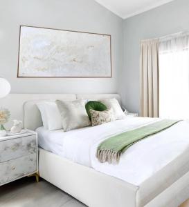 Ένα ή περισσότερα κρεβάτια σε δωμάτιο στο Green Paradise