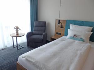 Postel nebo postele na pokoji v ubytování Kur- und Wellnesshotel Förch