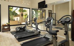 a gym with two tread machines and a treadmill at Royal Garden Villas, Luxury Hotel in Adeje