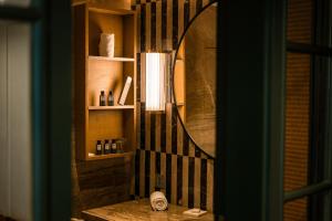 a bathroom with a mirror and a table with a sink at The Park Bangalore, MG Road in Bangalore +114 photos