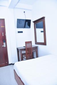 TV a/nebo společenská místnost v ubytování Ez Stay Guesthouse