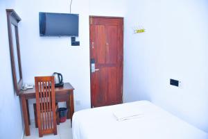 TV a/nebo společenská místnost v ubytování Ez Stay Guesthouse