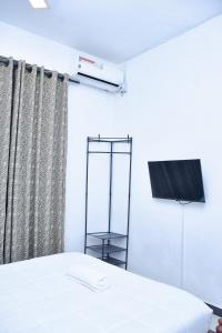 Postel nebo postele na pokoji v ubytování Ez Stay Guesthouse