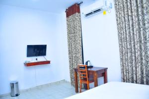 TV a/nebo společenská místnost v ubytování Ez Stay Guesthouse