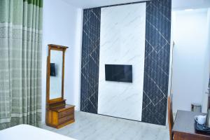 TV a/nebo společenská místnost v ubytování Ez Stay Guesthouse